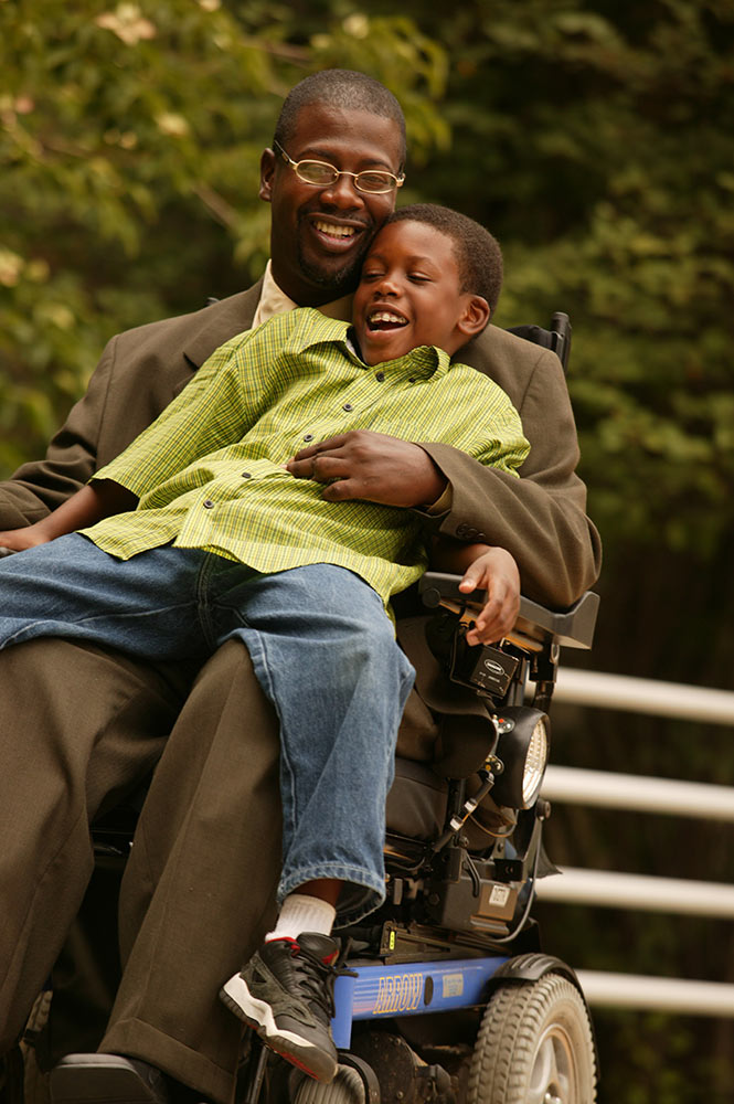 Inglis Gardens man in wheelchair with son