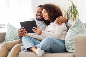 Zion Court couple with tablet